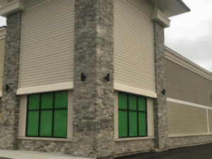 Commercial building facade finished with stone veneer, representing architectural masonry solutions.