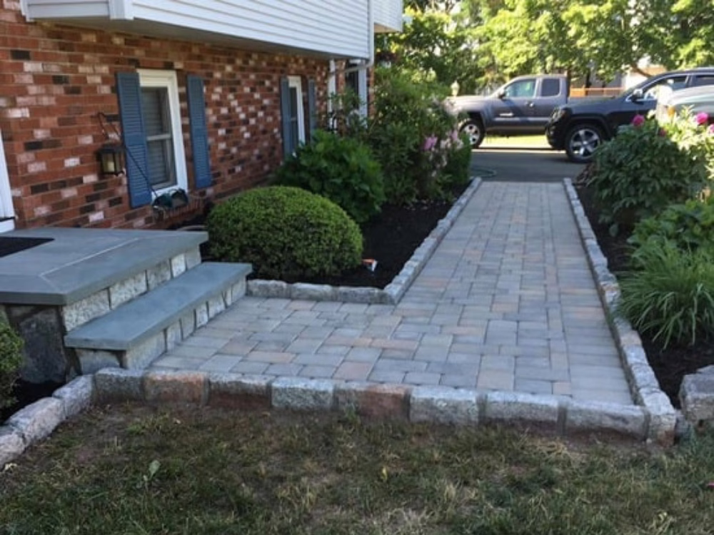 Front walkway with stone and paver design.