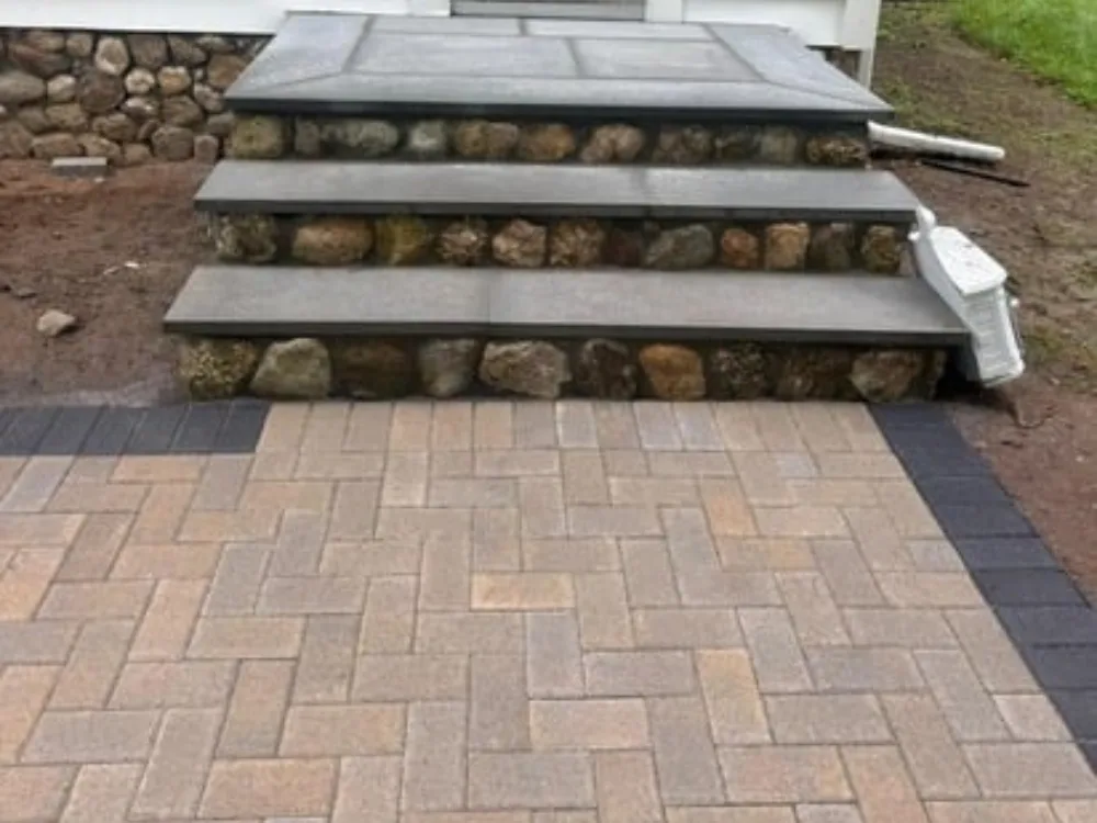 paver walkway and stone steps installation showing finished entry steps